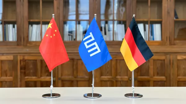 Table flags for China, Technical University of Munich, and Germany