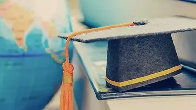 Globe and doctoral cap