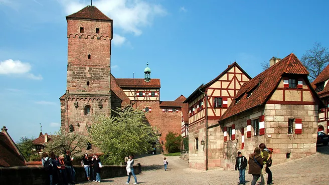 A small group of tourists in the old town of Nuremberg