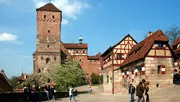 A small group of tourists in the old town of Nuremberg