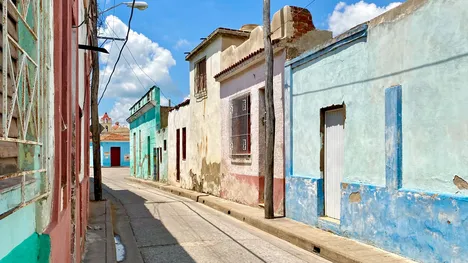 Street with small old buildings in pastel colors