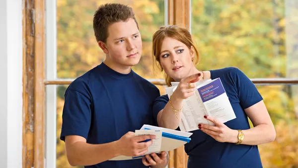 Two students selecting their study program