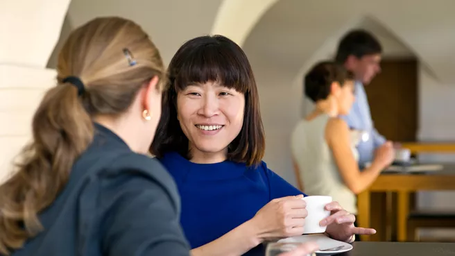 Two women talking over a cup of coffee