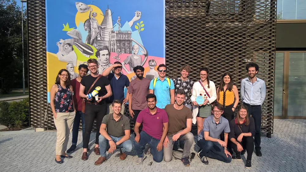 Group photo of the EVP participants in 2019 in front of a building at TUM Campus Garching