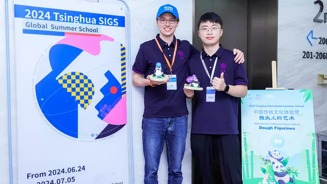 Two students in a friendly pose 