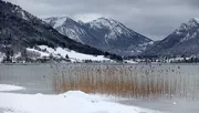 Lake Schliersee in the winter time with snowy mountain panorama