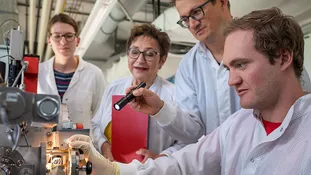 TUM PREP students with their supervisor during research work in the laboratory