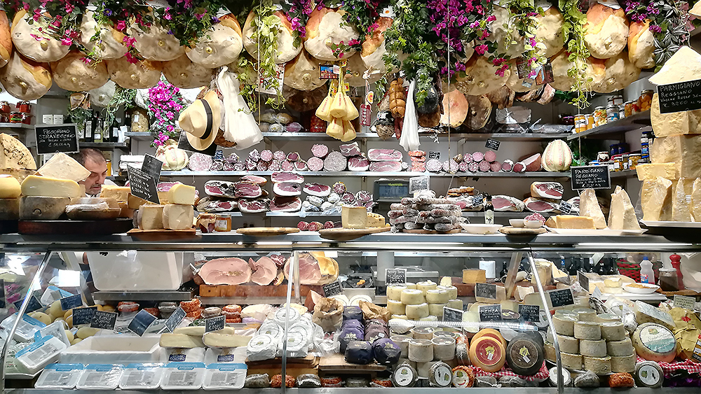 Well-stocked and with flowers decorated ham and cheese booth