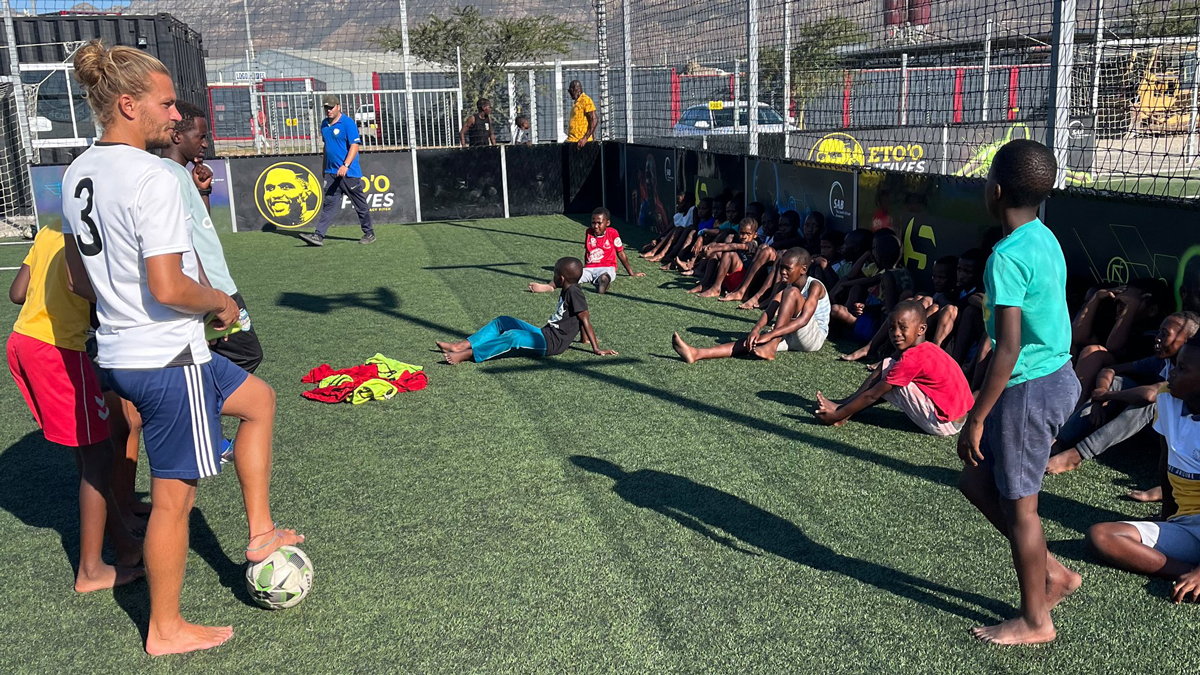 Christopher with soccer students during practice