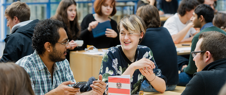 Students having a relaxed exchange and learning languages at the same time